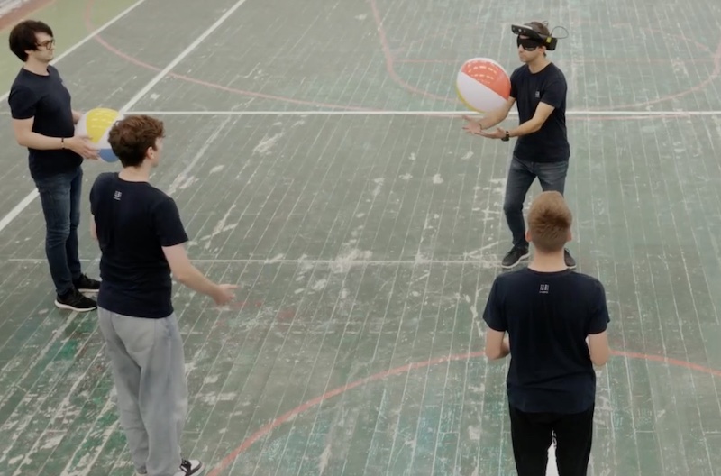 image person in headset catching ball